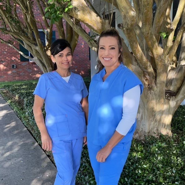 two nurses smiling